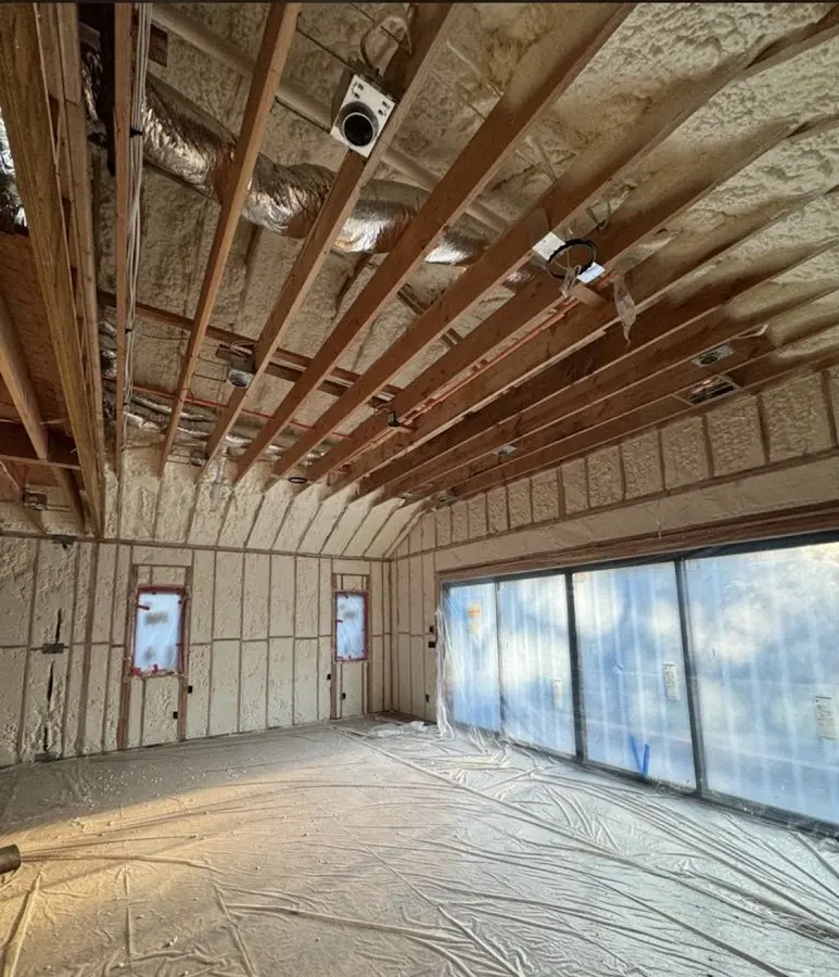 Interior walls and ceiling insulated with spray foam during new construction in Brunswick